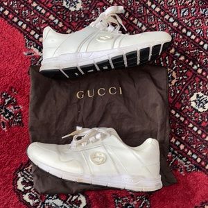 White Gucci athletic shoes and dust bag